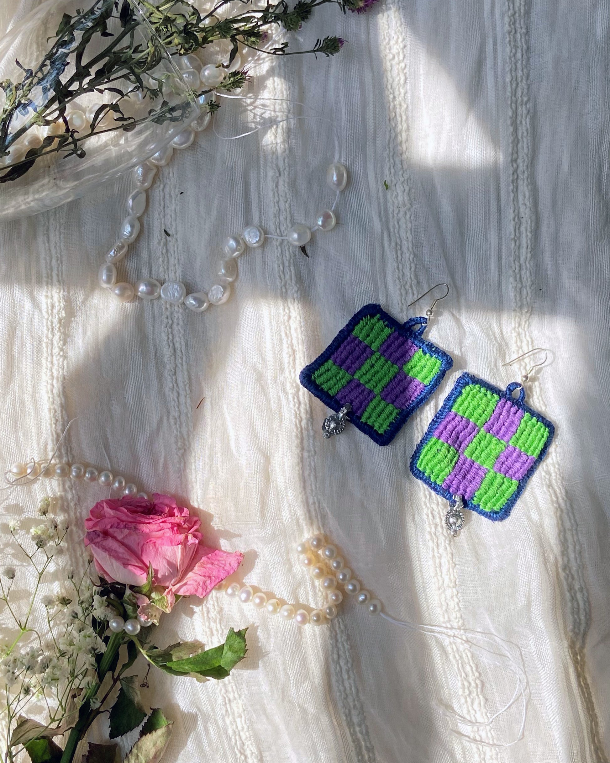 Hand embroidered green and purple drop earrings with silver hooks